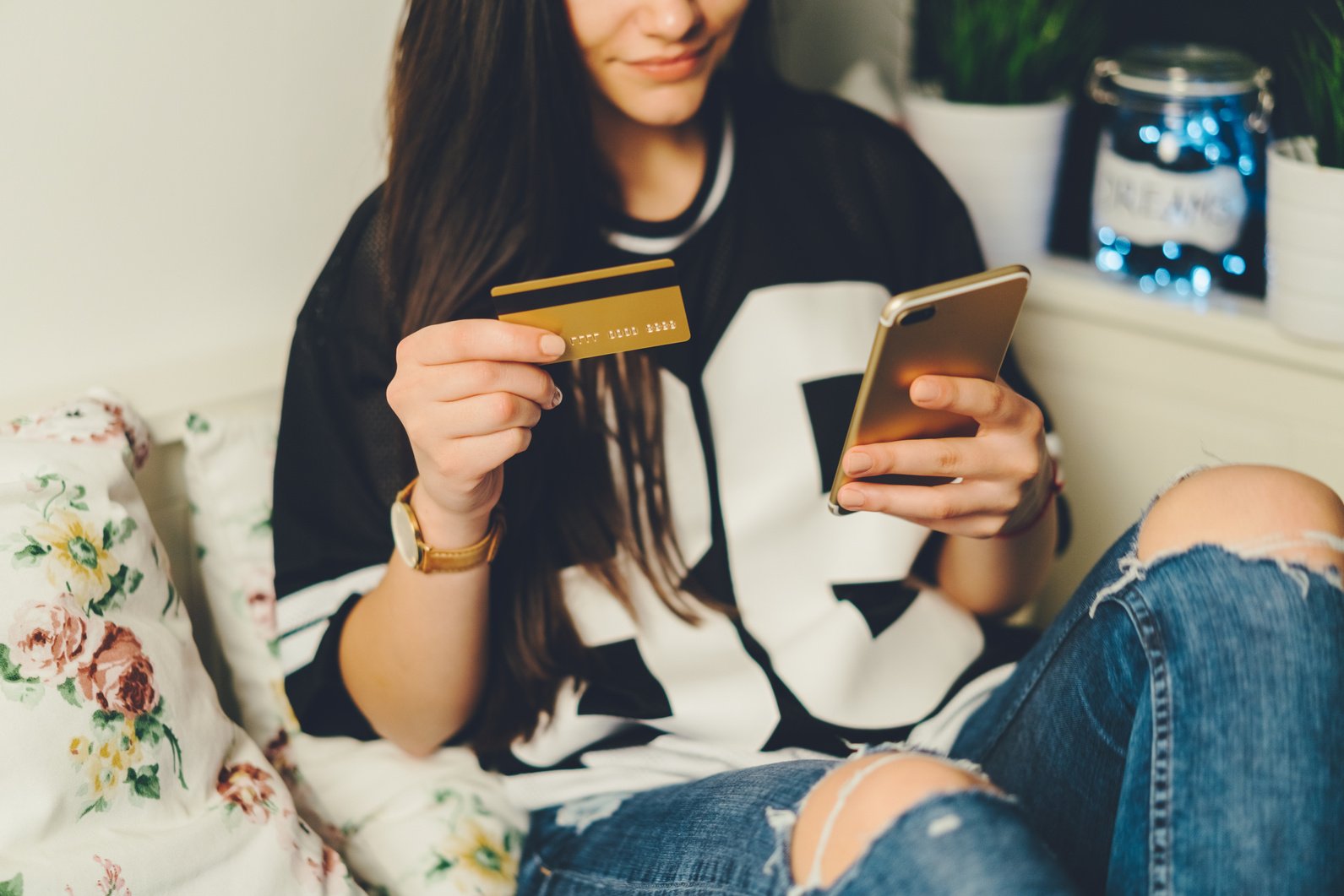 Gen Z girl shopping online with credit card